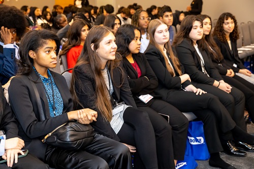 Crowd of students listening to speaker. Crowd of students listening to speaker.